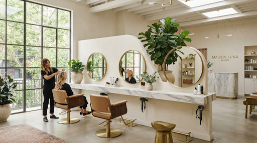 Sunlit salon interior with styling stations